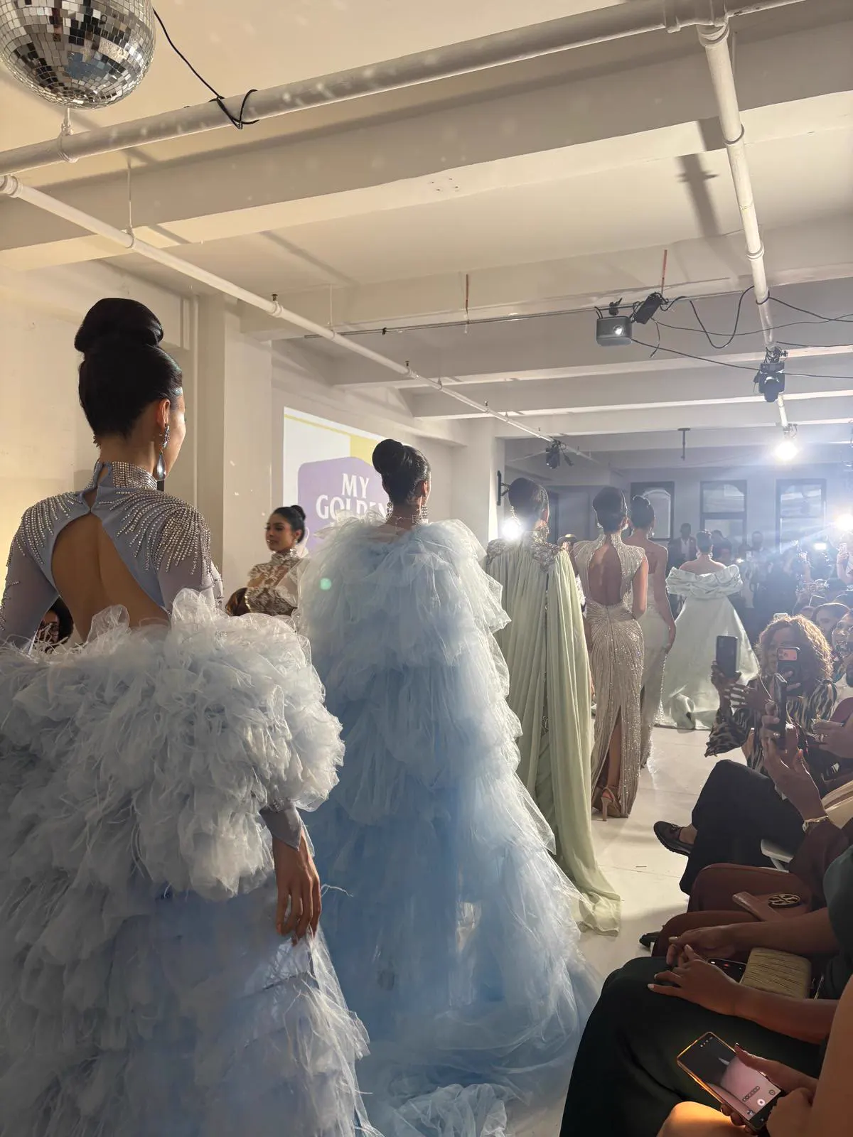 Ruffled couture gowns on the runway